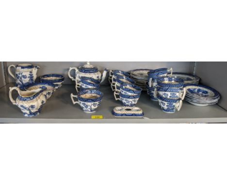 A Booths 'Real old Willow' part tea/coffee service to include, a teapot, side plates, saucers, cups a milk jug and other item