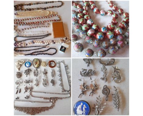 A quantity of vintage costume jewellery, mainly necklaces and brooches, to include marcasite brooches, rhinestone style neckl