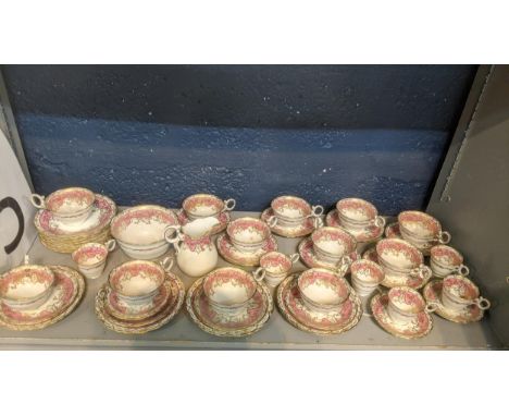 An early 20th century Bishop and Stonier Bisto Rockingham part tea service to include a sugar bowl, milk jug and cups and sau