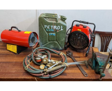 A collection of tools to include two Clarke Devil heaters, welding torches and pipes, a mountable vice, an adjustable wrench 