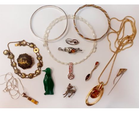 A small quantity of costume jewellery to include a silver bangle stamped 800, a silver and amber pendant, silver and white me