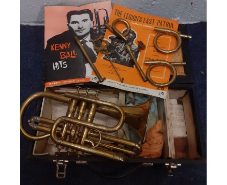 A gold tone cornet, no name or serial number, with accessories and case. Location:If there is no condition report, please req