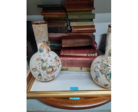 A mixed lot comprising a pair of floral relief vases and vintage books to include a 1996 Folio Society 'The Cream of Noel Cow