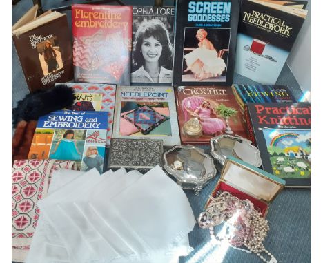 A mixed lot to include books on sewing and actresses, a white cotton tablecloth and napkins, a cross stitch table runner, cos