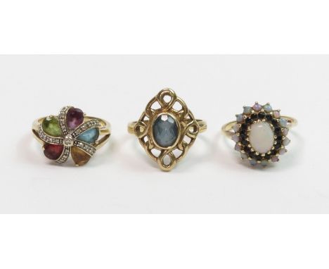 A 9 carat gold multi gem stone and diamond cluster ring, finger size M ½; and two other 9 carat gold gem set dress rings; 11 