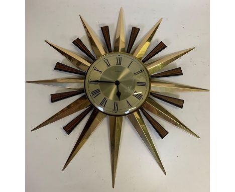 A Metamec sunburst wall clock in the 1960's style, 61cms diam 