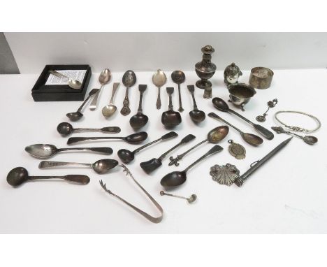 A collection of assorted silver spoons; a pair of claw tongs; a napkin ring; a salt; two peppers; a watch fob; a thimble; a b