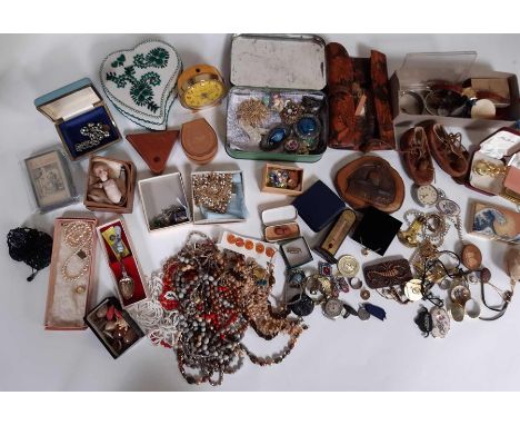 A small suitcase containing costume jewellery; beads; an alarm clock; coins; and other items                                 