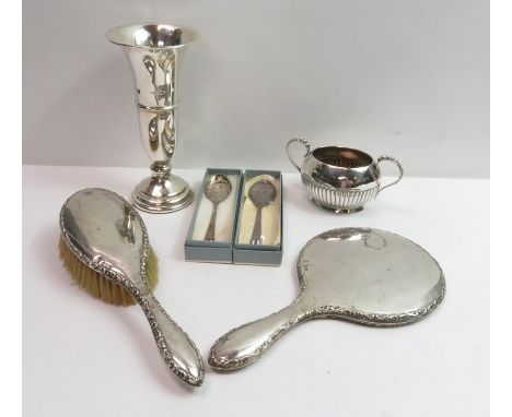 A silver loaded bud vase; with a late Victorian small silver two handled sugar basin; a silver backed hand mirror and hair br