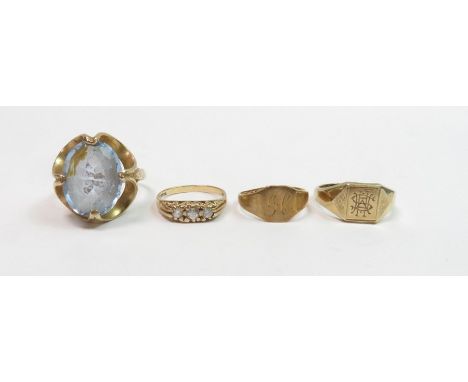 A 9 carat gold signet ring; another similar; a three stone 9 carat gold ring; and a single stone 9 carat gold dress ring; 13 