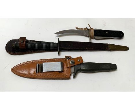 A FS (Fairbairn Sykes) fighting knife in leather scabbard, blade 16.5cms long together with a military issue knife with curve