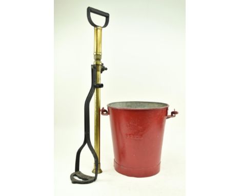 A WW2 vintage floor standing stirrup pump and a sand bucket. The Redcliff patent standing stirrup pump having a brass tube wi