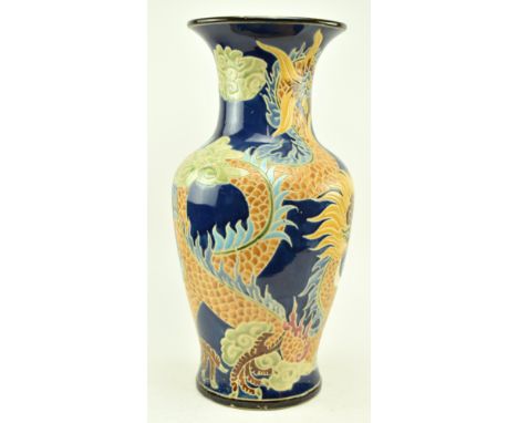A large vintage mid century Oriental possibly Vietnamese enamelled vase. The blue ground vase depicting two dragons chasing a