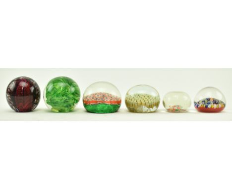 A collection of six vintage 20th century glass paperweights, including four millefiori examples. The paperweights of varying 