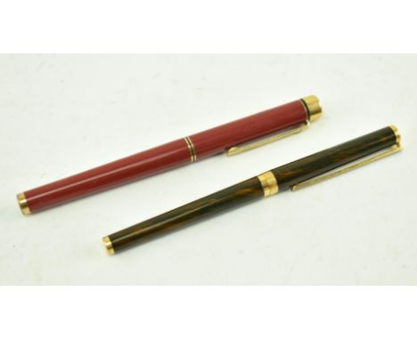 A vintage 20th century Sheaffer fountain pen, along with a Dupont ballpoint pen. The Sheaffer pen in red, marked to nib Sheaf