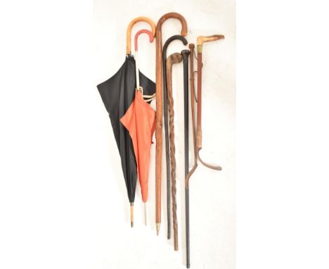 A collection of early 20th century &amp; onwards vintage walking sticks, canes, umbrellas &amp; riding crops. The lot compris