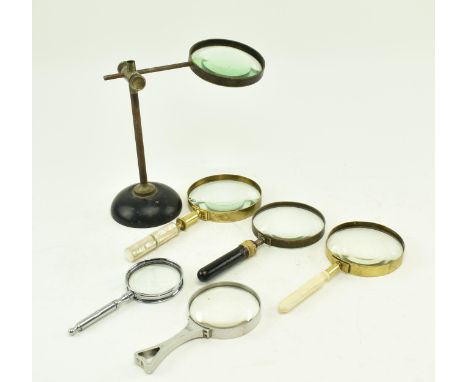 A collection of six 19th &amp; 20th century magnifying glasses. The lot comprising a mother of pearl handled brass magnifying