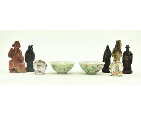 A collection of nine Chinese ceramic and figurine pieces. The lot to include a pair of Republic period pale green glazed tea 