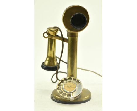 An early 20th century circa 1920s / 30s brass &amp; bakelite candlestick telephone. The telephone having a rotary dial with h