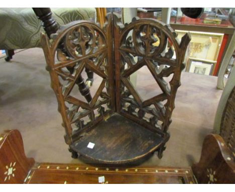 An eastern hardwood book slide, bone inlaid bearing stamp 'Made in Britain' to base together with a corner wall mounted shelf