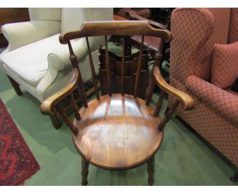 A mahogany penny seat armchair, stick-back with turned supports, cross stretcher