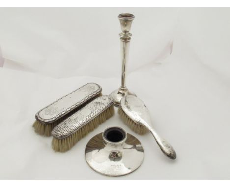 A silver candlestick, a capstan inkwell (no lid) and three dressing table brushes (5) 