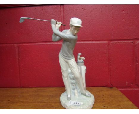 A Lladro figure of a golfer, boxed,  28cm tall