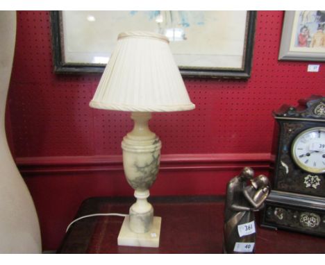 A cream alabaster urn form table lamp with a cream pleated shade, 48cm tall approx.