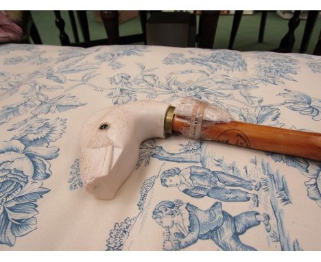 A Roy Hewson wood carved walking stick with white carved Duck handle, 5cm broken beak (attached) glass eyes