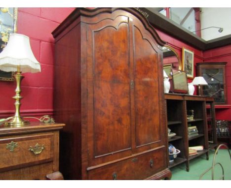 A walnut two door fitted wardrobe above single drawer on cabriole leg base, 190cm tall