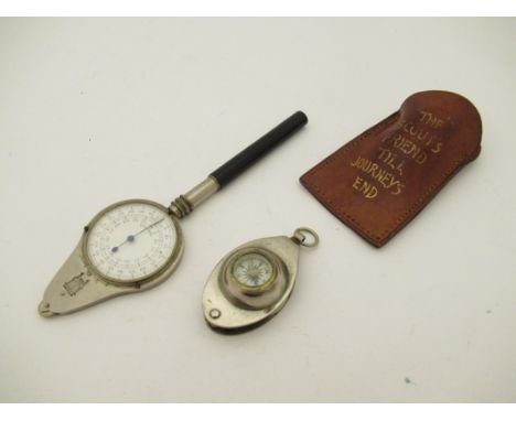 A map reading distance wheel with two scales 1:100,000 and 1:80,000 together with leather cased scout's pocket compass