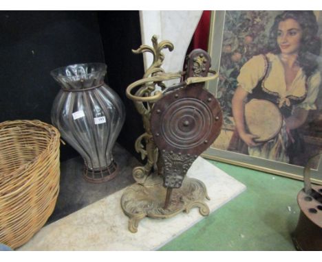 A brass figural umbrella/stick stand with a set of studded mahogany bellows (2)