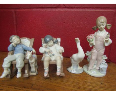 Four Lladro figures, goose, boy and girl in rocking chairs with their toys, three with boxes