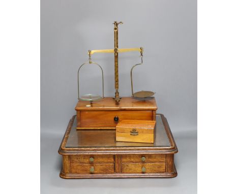 A Victorian oak instrument stand and a set of Stanley scales with weights