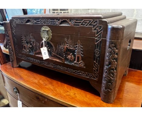 A small Chinese carved camphorwood trunk, length 80cm, depth 38cm, height 40cm
