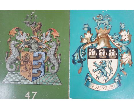Four tin and enamel armorial signs,largest 38 cms x 36 cms,