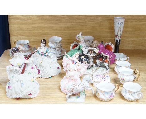 A group of Continental porcelain cabinet cups and saucers, a vase, crinoline figures and a Meissen horse,horse 9 cms high,