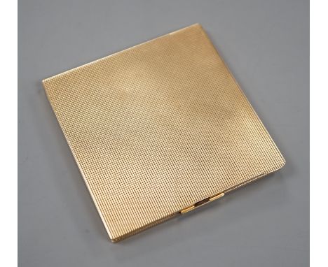 A 1940's engine turned 9ct gold compact, 82mm, gross 117.8 grams.906