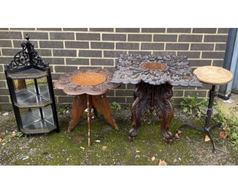 Two Indian carved hardwood occasional tables, a Victorian ebonised corner wall bracket and an industrial stool
