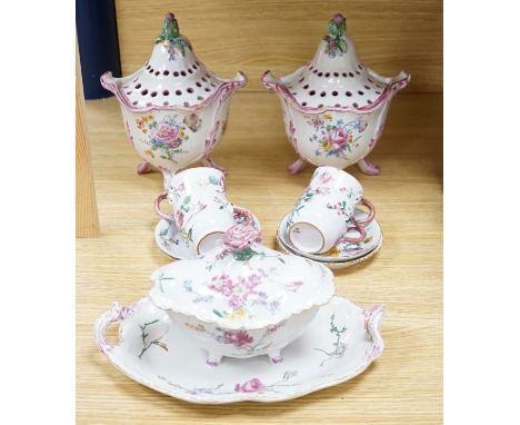 A group of of French faience pottery including a pair of pot pourri vases and covers, a tureen with integral stand, cover, la