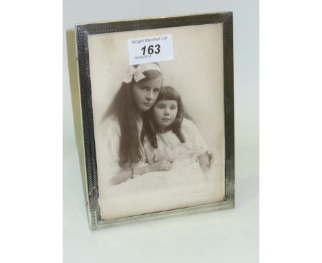 A Rectangular silver photograph frame with engine turned decoration., Birmingham 1922.