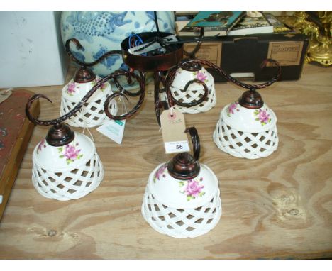 A Painted metal five branch ceiling light fitting with ceramic open work lattice shades. (5 LT BZ )


