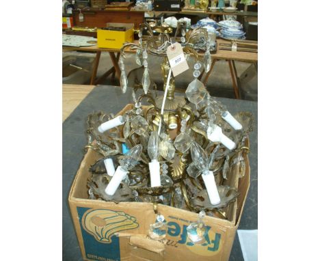 A Gilt metal and droplet eight branch chandelier with " S " shaped leafy branches.
