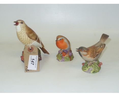A Royal Worcester model of a thrush  and two others , robin and sparrow. (3)