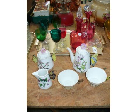 Two 19th Century cranberry glass decanters with clear glass reeded loop handles, coloured glass wines , a part tea service wi