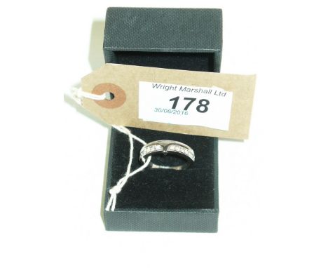 An 18ct white gold and white stone ring.