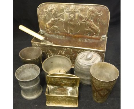 A 19th Century Dutch brass candle box, a similar smaller box containing two clock keys, three various metal beakers, a pewter