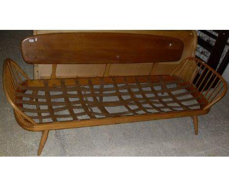 An Ercol light elm studio couch/sofa with elm back and beech frame   CONDITION REPORTS  Various impressed marks, light scratc