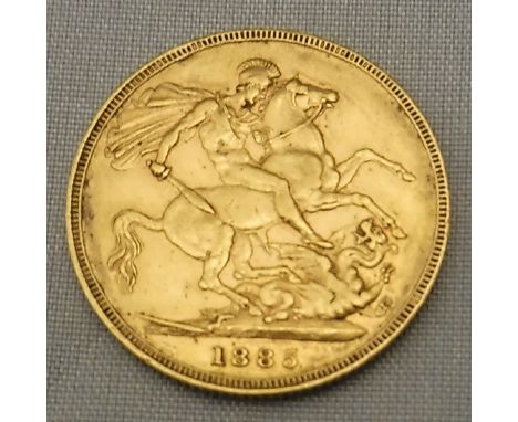 A Victorian gold sovereign 1885   CONDITION REPORTS  Some light scratches, signs of wear, some dark marks, dented type mark a