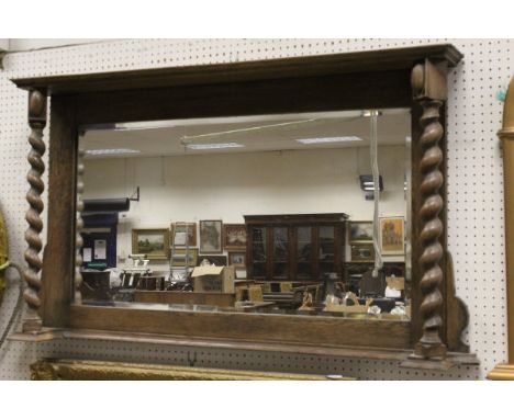 An oak framed overmantle mirror with barley twist supports, and three fireside companion tools